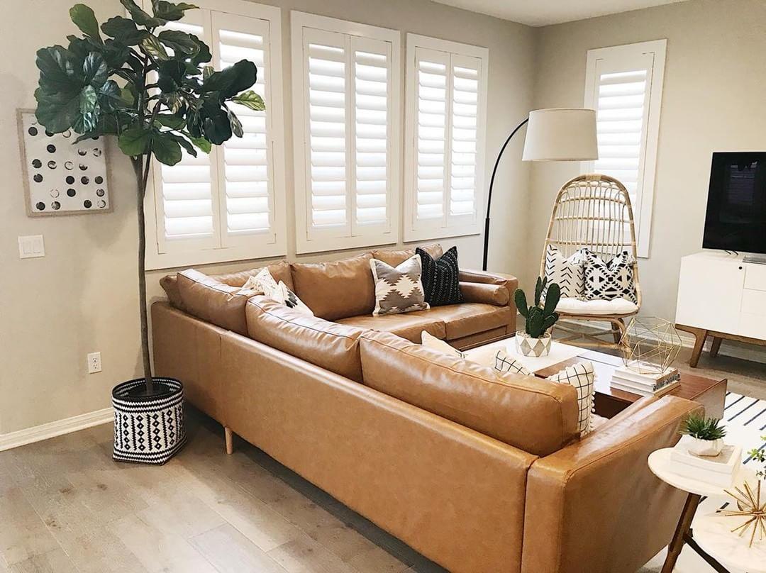 Warm living room with our Polywood shutters in Gainesville.